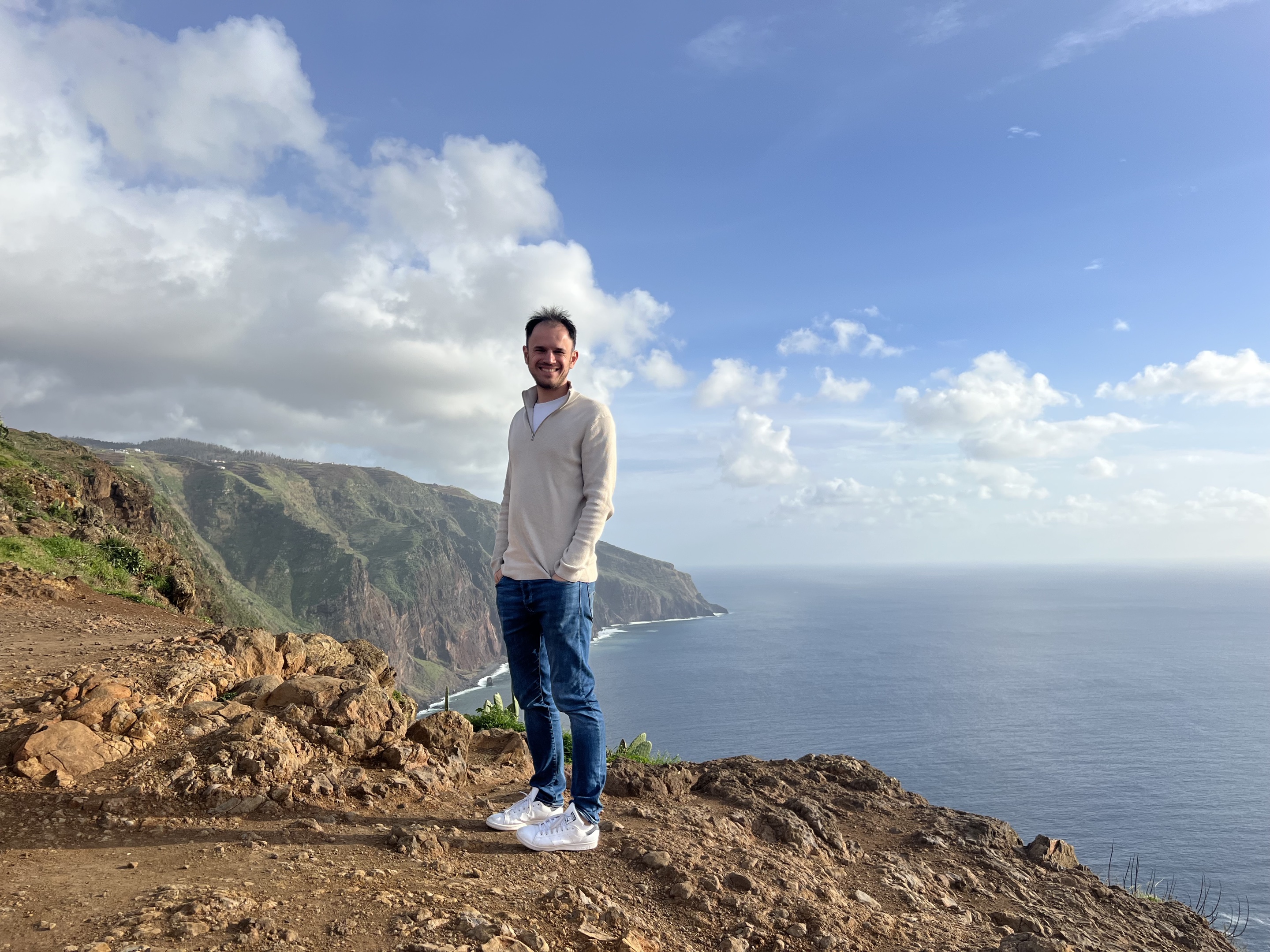 Daniel Gruber standing on a coastal cliff in Madeira